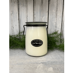 Cream candle in a metal jar labeled Sweet Tobacco leaves