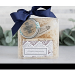 Gift set with soap and balm in a clear box tied with a navy ribbon