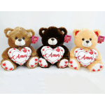 Three teddy bears holding heart pillows with the word Amor.
