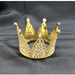 Gold jeweled crown on black fabric