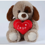 Plush dog holding a red heart with the word Love