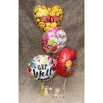 Four heart-shaped and round foil balloons with birthday and love messages