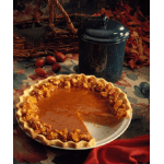 Pumpkin pie on a plate with a slice removed