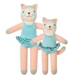 Two knitted cat plush toys in pastel blue and pink outfits