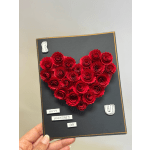 Red paper flower heart on a black Valentine card