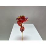 Single red metallic rose with iridescent leaves on a stem