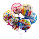 Cluster of colorful birthday balloons with printed messages