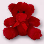 Red teddy bear with a ribbon bow
