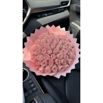Large bouquet of pink roses wrapped in pink paper