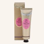 Two tubes of rose tea butter hand cream in decorative packaging