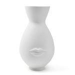 White sculptural vase with a face and lips