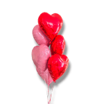 Cluster of heart-shaped red and pink balloons
