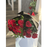 Bouquet of red roses wrapped in black paper