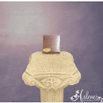 Box of chocolates on an ornate pedestal against a purple backdrop