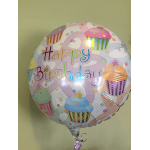Round birthday balloon with cupcake graphics and colorful lettering