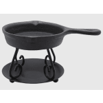 Black cast iron skillet on a metal stand