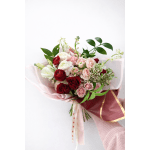 Bouquet of red, pink, and white roses wrapped in pink paper