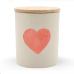 Cream candle jar with a pink heart on the front and a wooden lid