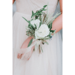 White bridal bouquet with greenery and ribbon