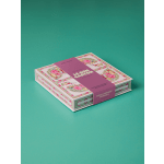 Decorative box of honey lavender caramels on a teal background