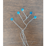 Blue jeweled floral picks on twisted silver wires