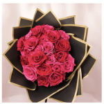 Bouquet of pink and red roses wrapped in black paper with gold trim