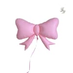 Pink bow-shaped balloon with a long ribbon tail