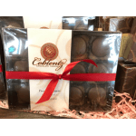 Boxed chocolates tied with a red ribbon