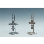 Two decorative metal cross ornaments on stands