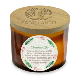 Amber candle in a glass jar with a wooden lid and Christmas label