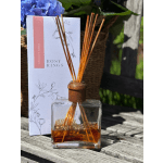 Apricot rose reed diffuser in a glass bottle with reeds and matching box