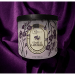 Lavender-scented candle in a white jar with a black lid