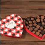 Heart-shaped box of assorted chocolates with a heart-patterned lid