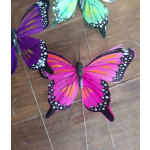 Colorful butterfly decorations on a wooden floor