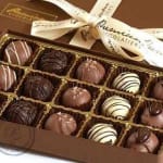 Box of assorted chocolates with a ribbon bow