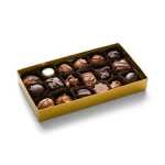 Box of assorted chocolates in a gold tray
