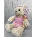 Plush teddy bear in a pink dress holding a star wand