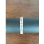 Pair of rhinestone bracelets on a dark surface