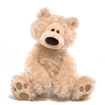Beige plush teddy bear with floppy limbs sitting against a white background