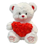 White teddy bear holding a red heart