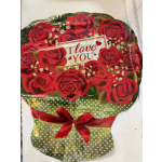 Heart-shaped bouquet of red roses with an "I love you" card