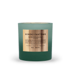 Teal scented candle in a glass jar with a metallic label