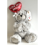 Gray plush teddy bear holding a red heart balloon