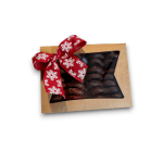 Box of chocolate-covered treats tied with a red snowflake ribbon