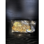 Bag of Dakota Salted Nut Roll candy on a dark surface