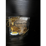 Boxed candy with a gold ribbon and label