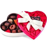 Heart-shaped box of assorted chocolates with a white ribbon