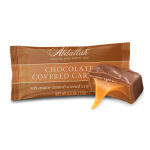 Wrapped chocolate-covered caramel candy with a caramel piece shown beside it