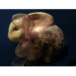 Decorative ceramic rabbit figurine with a pink ribbon bow