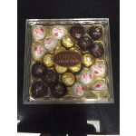 Box of Ferrero Rocher and Raffaello chocolates in clear packaging